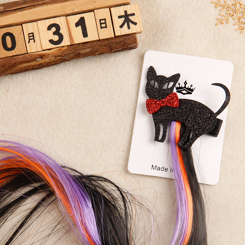 A black cat flutters hair pins