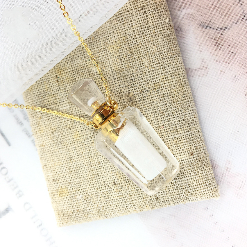 White crystal perfume bottle + chain