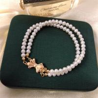 bracelet en laiton de perle d'eau douce cultivée, avec laiton, Double couche & bijoux de mode & pour femme, blanc, 4-5mm Environ 7.5 pouce, Vendu par PC