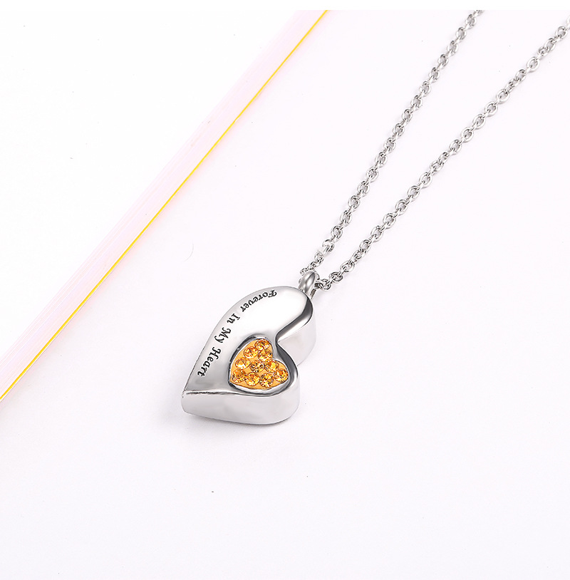 Yellow diamond pendant and silver chain