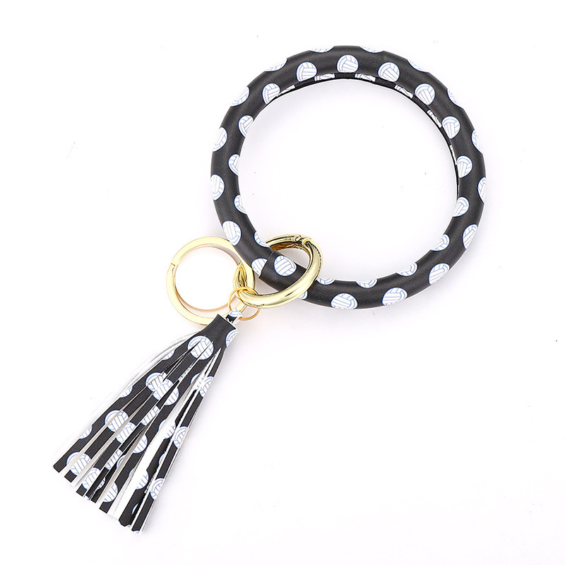 Black on white football bracelet key chain