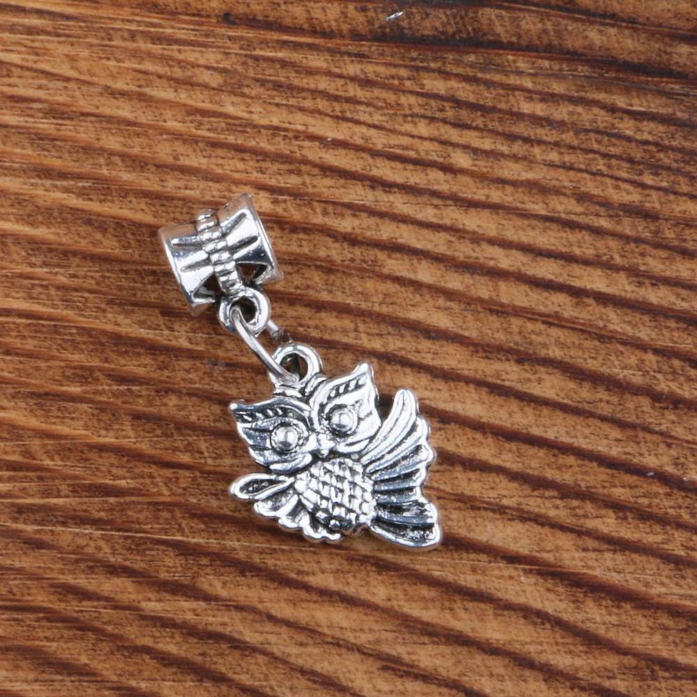 Ringed owl-shaped pendant