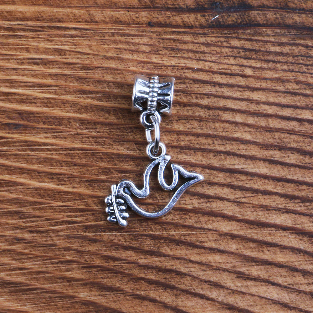 A bird pendant with a ring