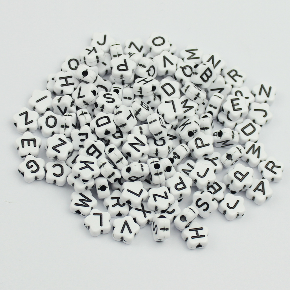 8*8mm black flower-shaped letter beads on white background