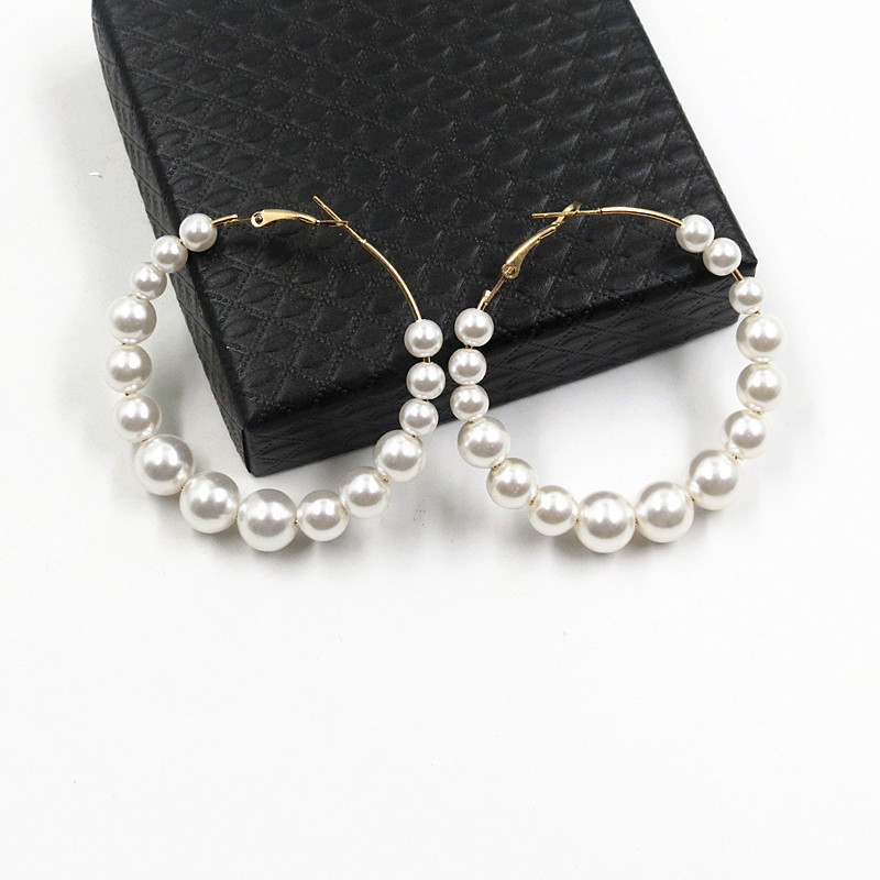 Large and small pearl earrings