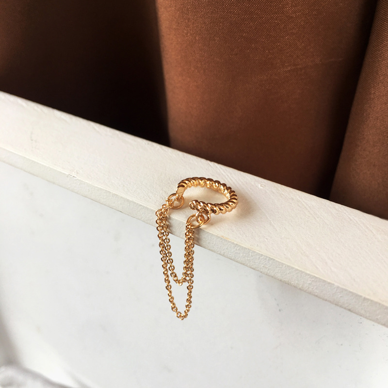 A gold earring clip