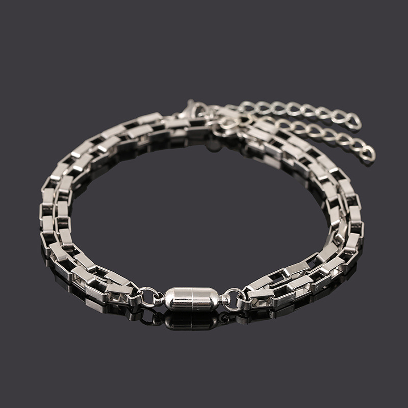 A pair of stainless steel chain D