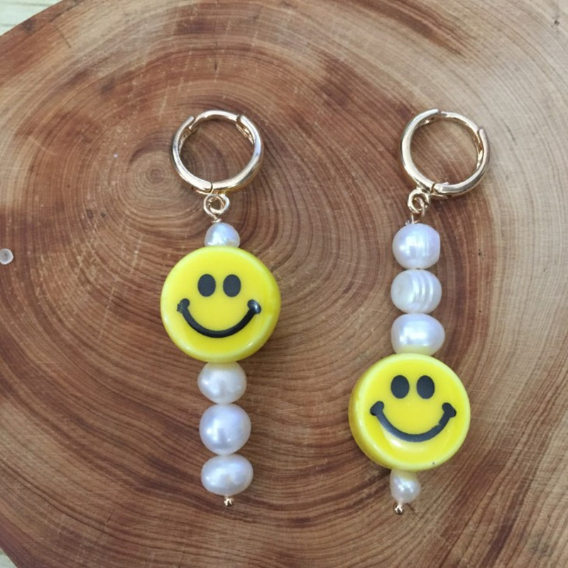 A pair of smiley face earrings