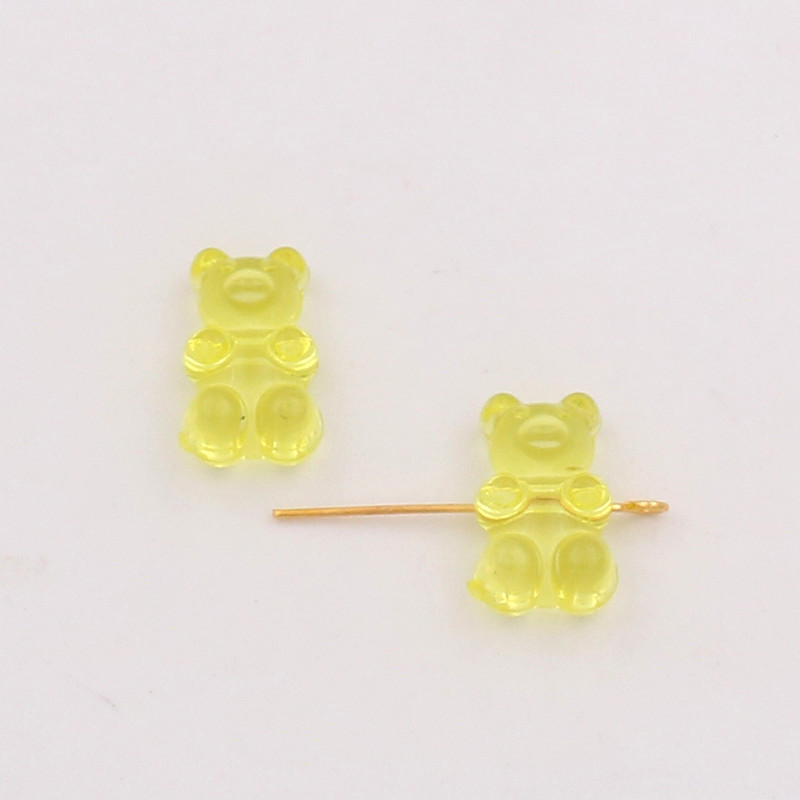 Yellow cross hole bear channeling beads
