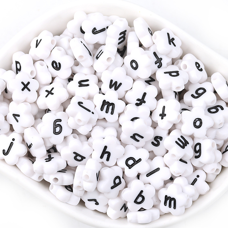 A pack of 100 white with black lowercase letters,