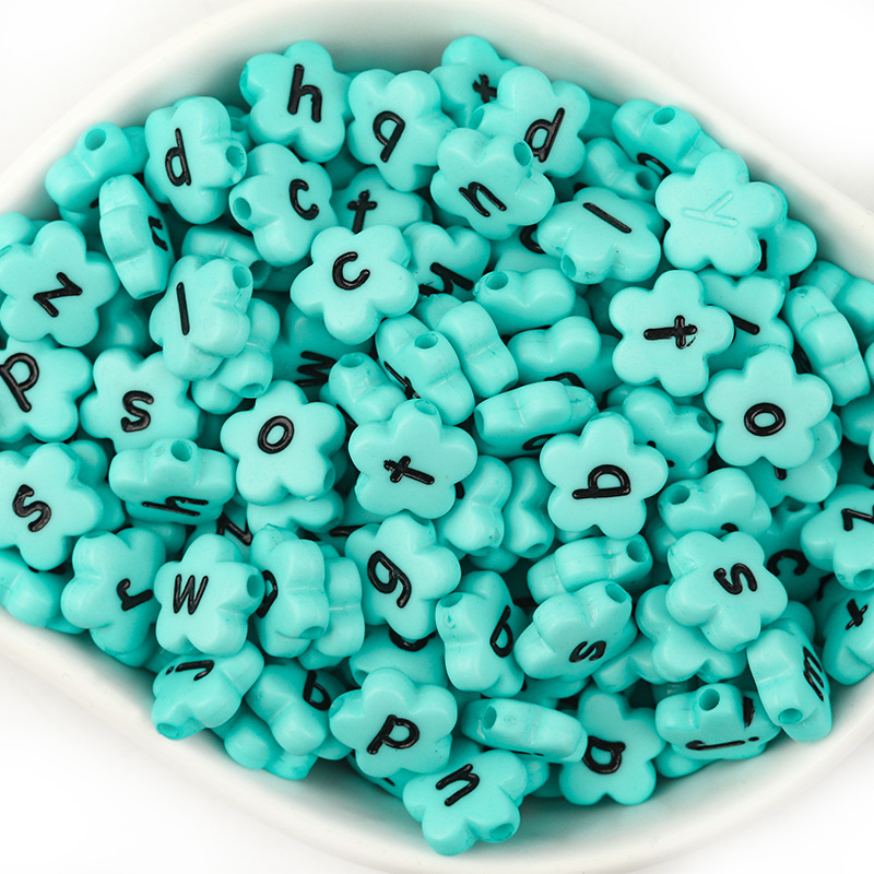 A pack of 100 lake blue with black lowercase lette
