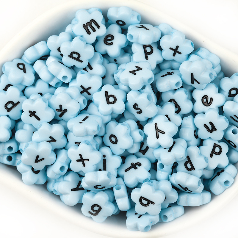 A pack of 100 light blue with black lowercase lett
