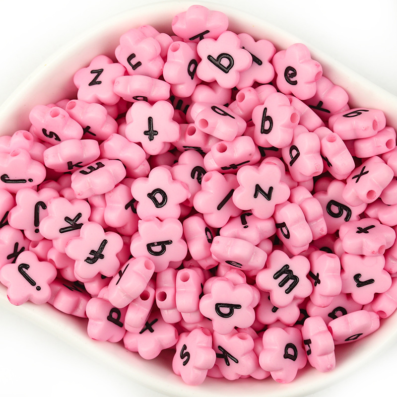 Pink with black lowercase letters in a pack of 100