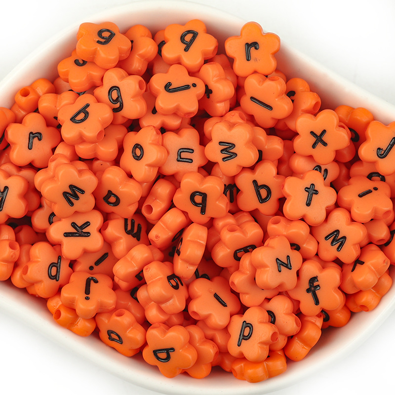 Orange with black lowercase letters