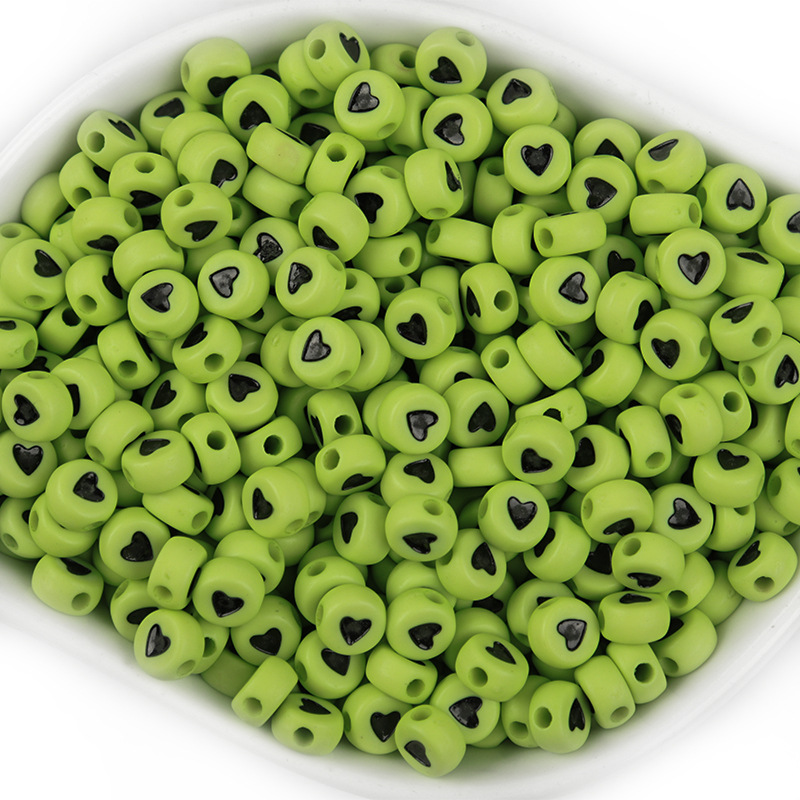 A pack of 100 green and black hearts,