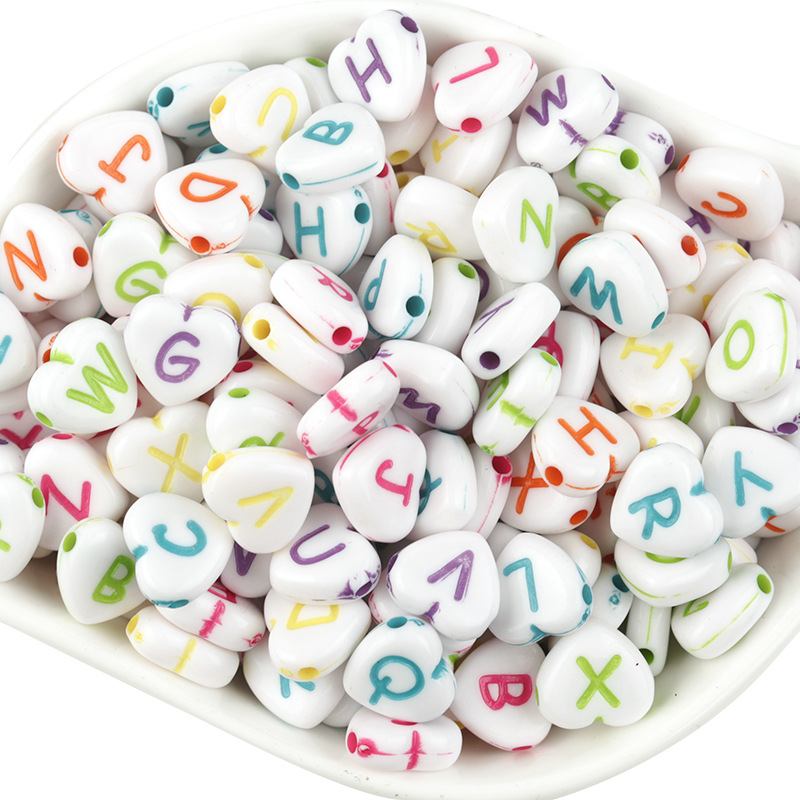 A pack of 100 hearts with colored letters on white