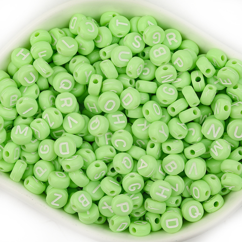 A pack of 100 green with white letters,