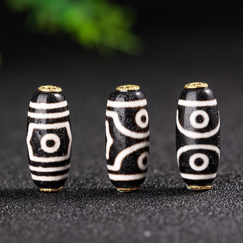 The three - eyed Dzi Beads ( about 13*30mm ) / pc