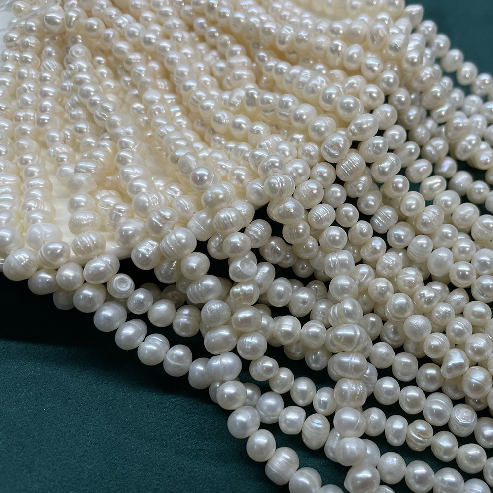 White threaded beads, about 63 beads, 6-7mm