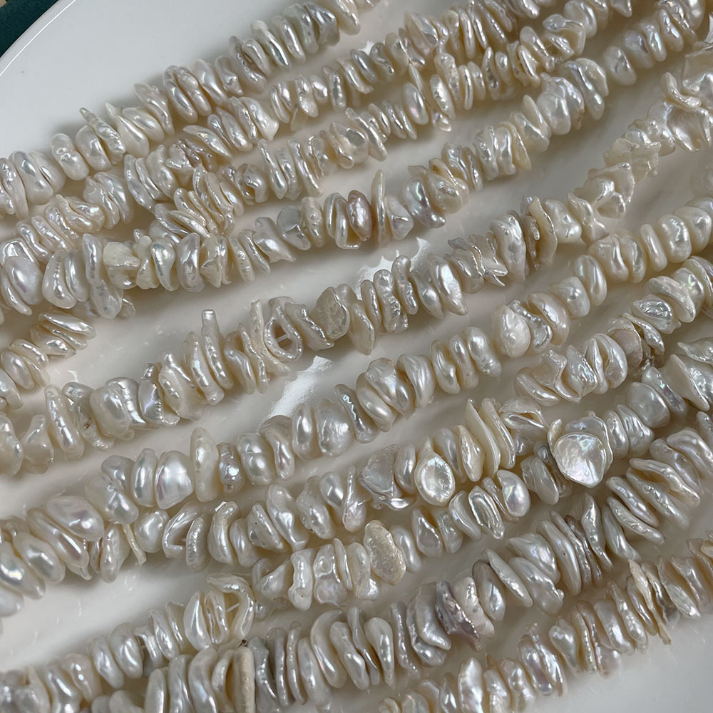White, about 113 beads/strand