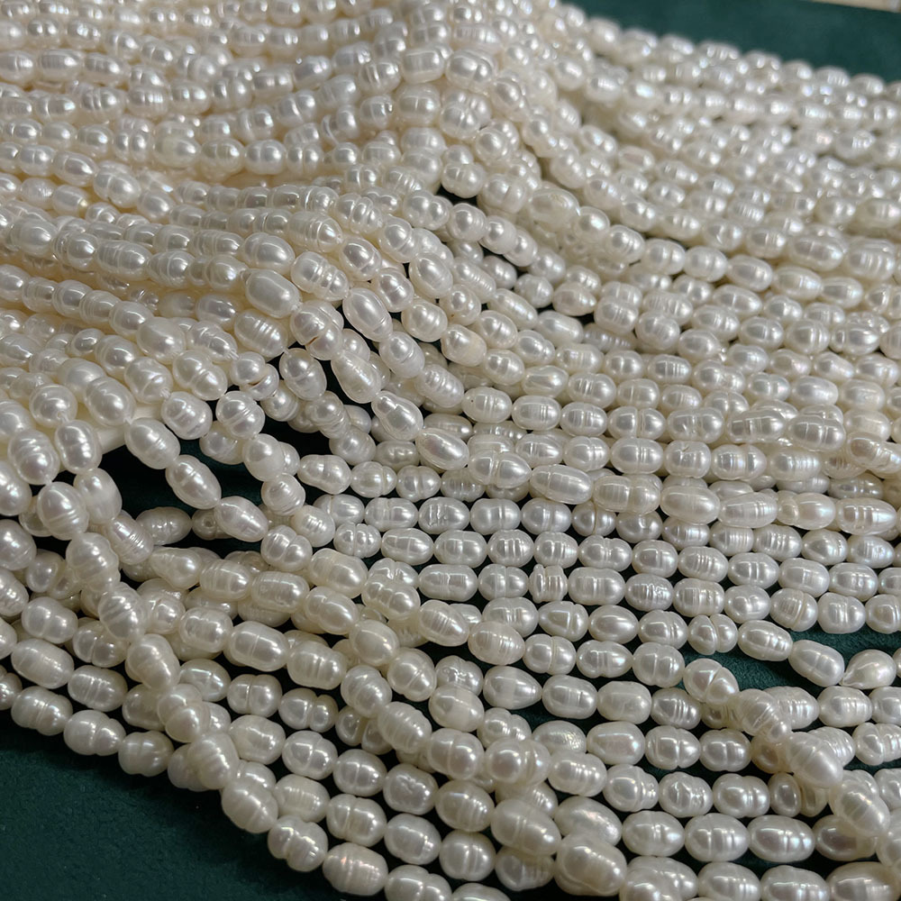 White thread beads, about 53 pieces