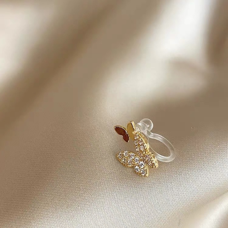 7# One golden double butterfly ear clip