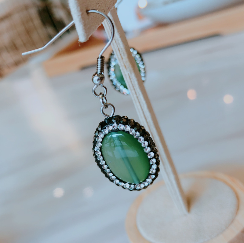 green earrings C
