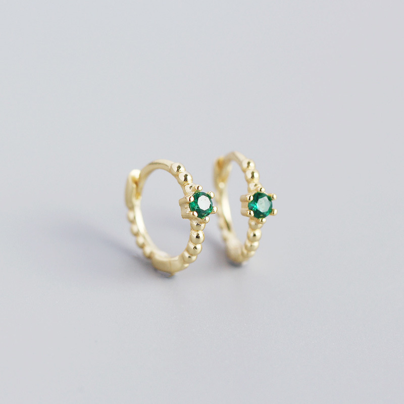 gold color with green rhinestone