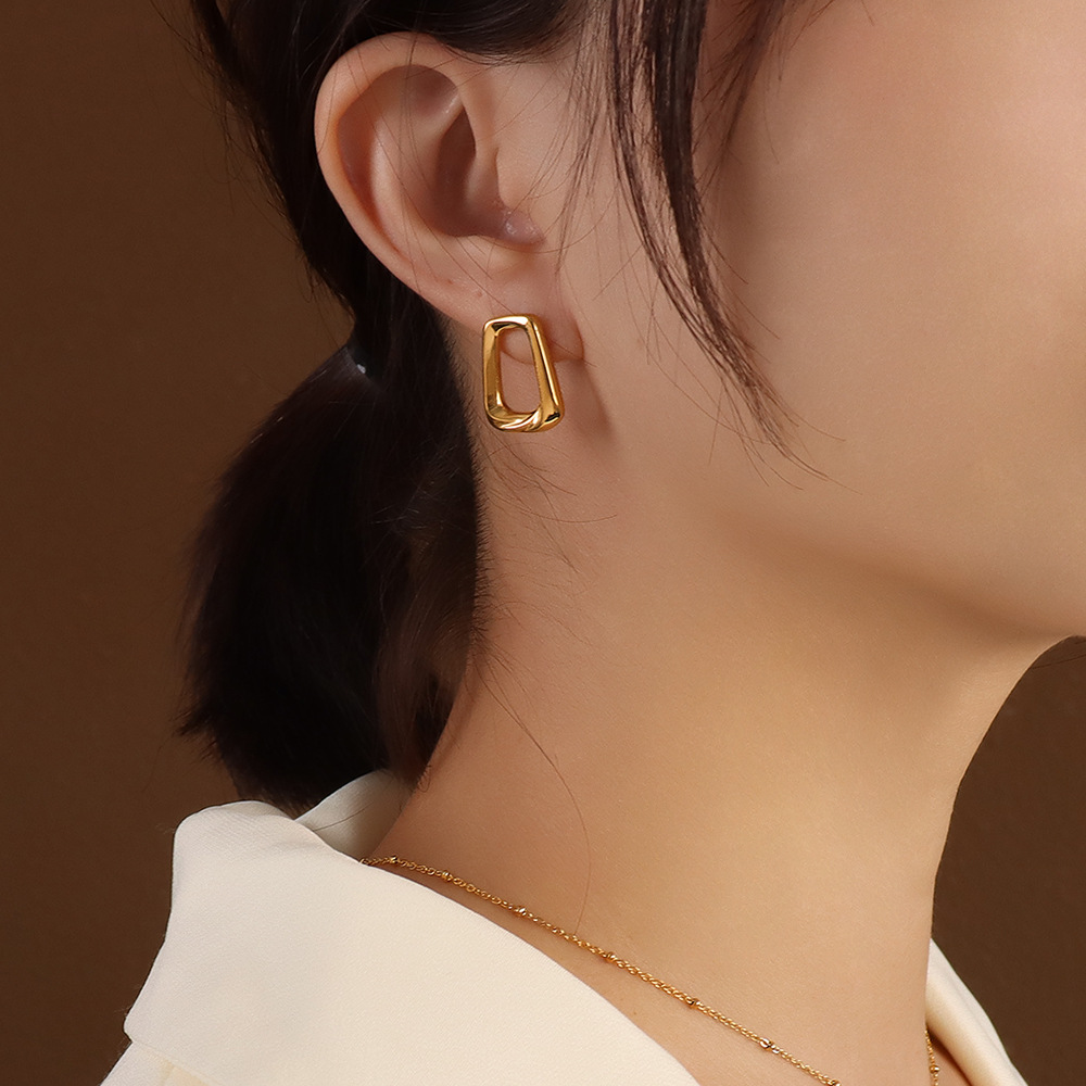 3:A pair of gold earrings