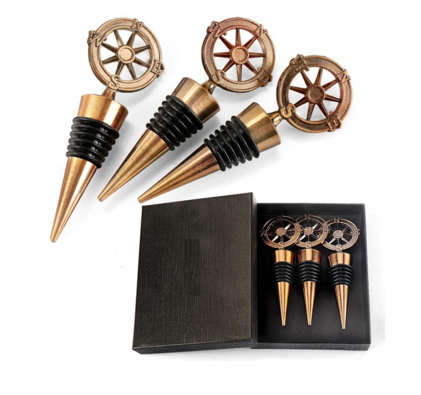 Three black gift boxes of bronze compass liquor plugs