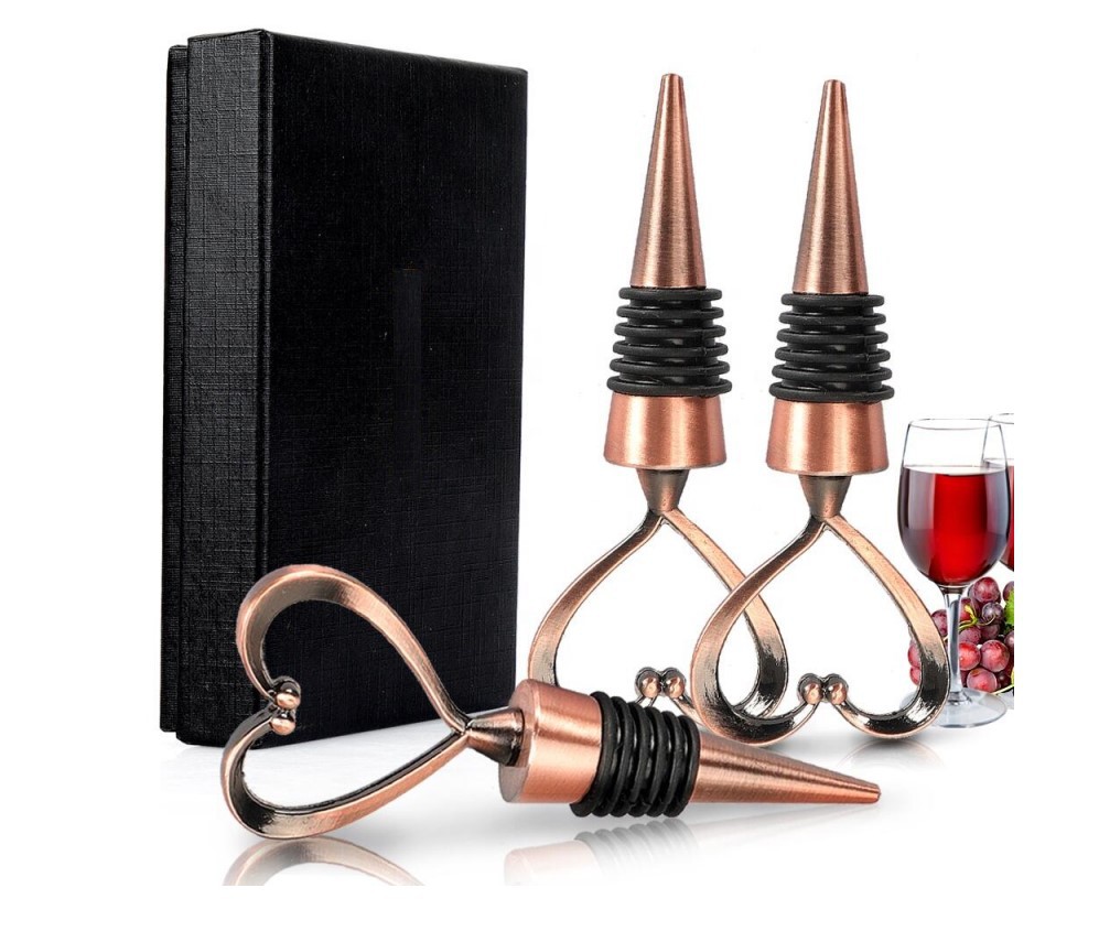 Three black gift boxes of bronze positive wine plugs