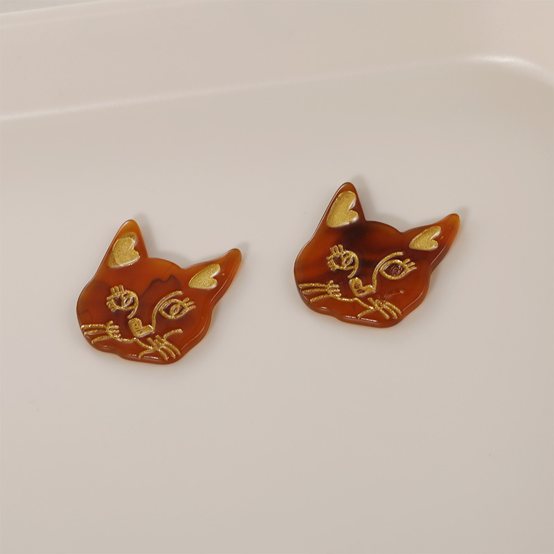 5:amber cat with holes