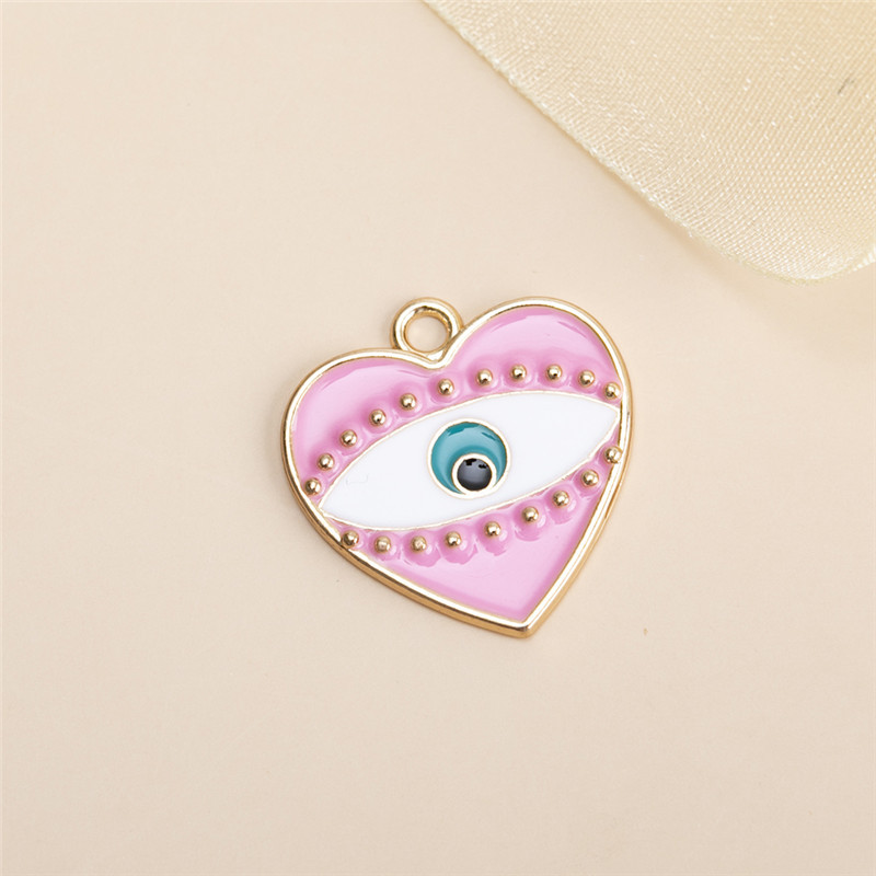10 pink heart shaped eye pendants 25x24mm