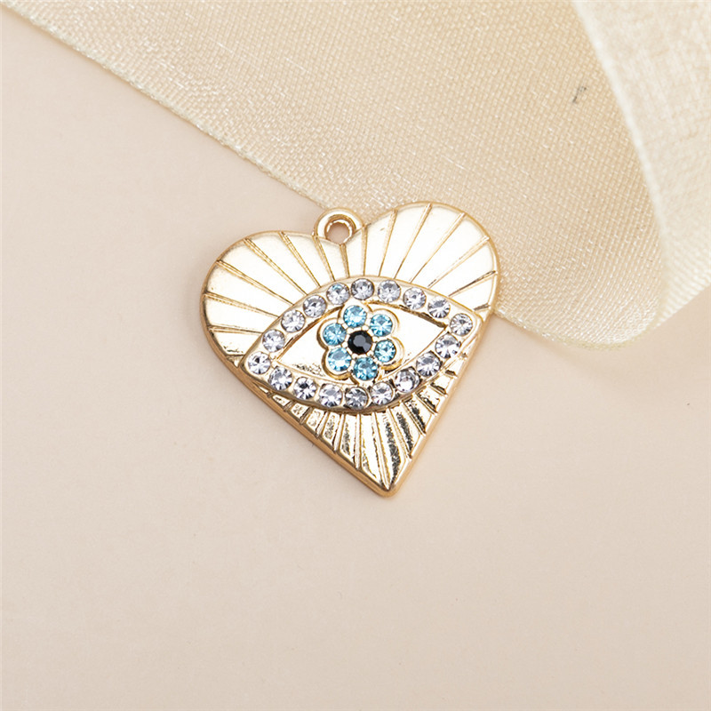 10 gold heart shaped eye pendants 19x20mm