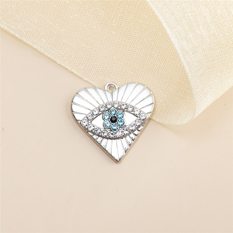 8:10 silver heart shaped eye pendants 19x20mm