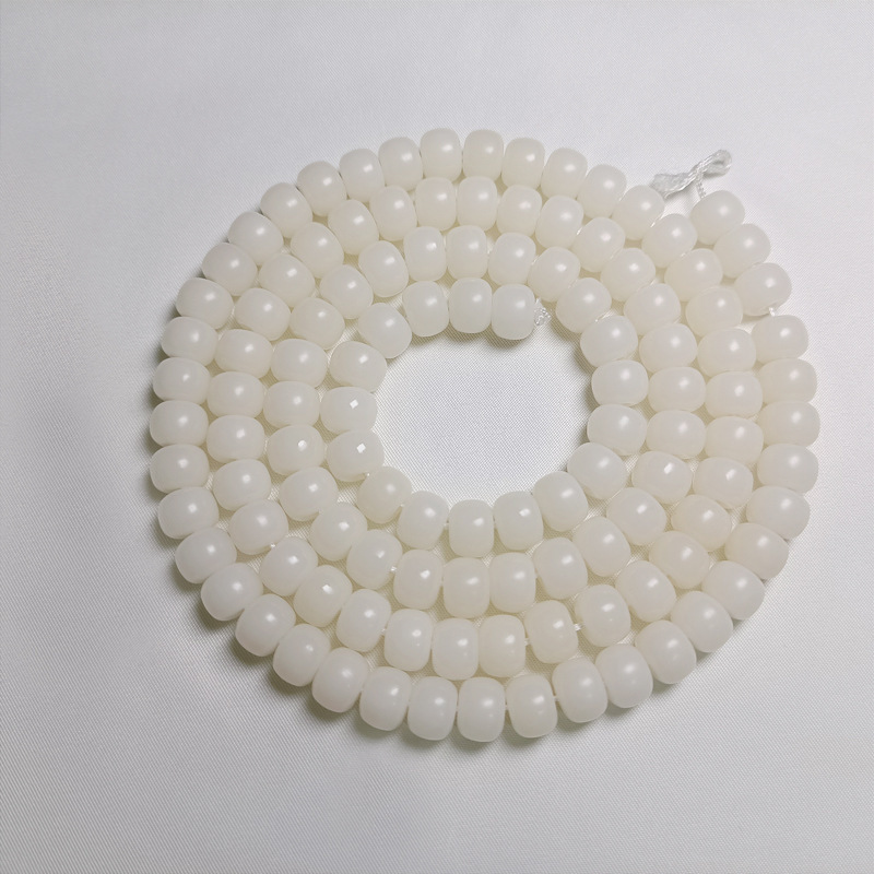 There were 11412 * 9mm barrel beads of white jade
