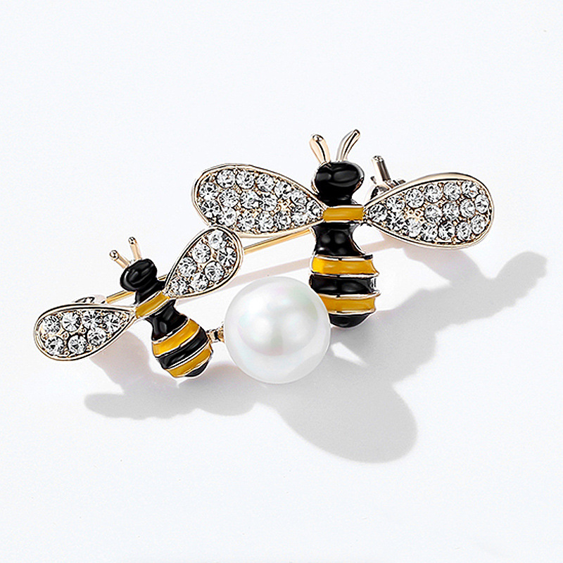 Yellow and black double bee brooch