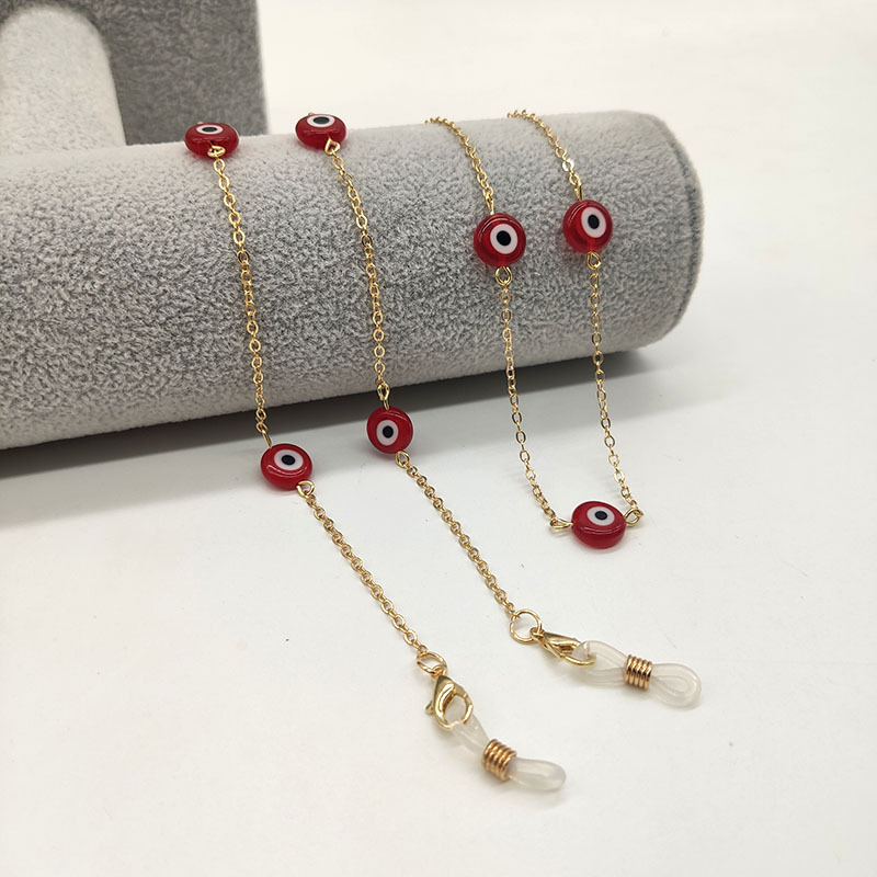 Gold chain red beads