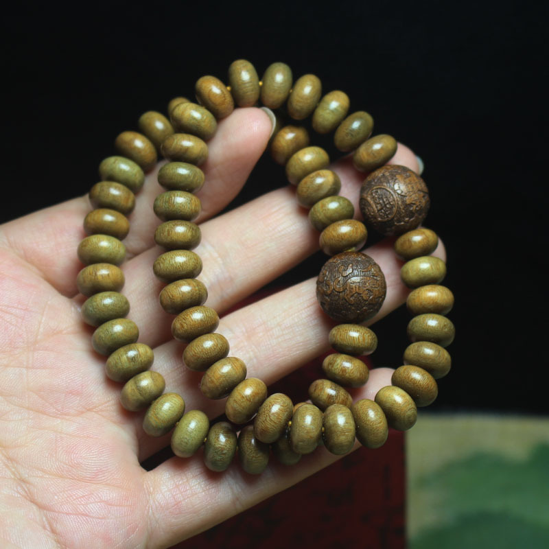 1:Perle di ebano dorato