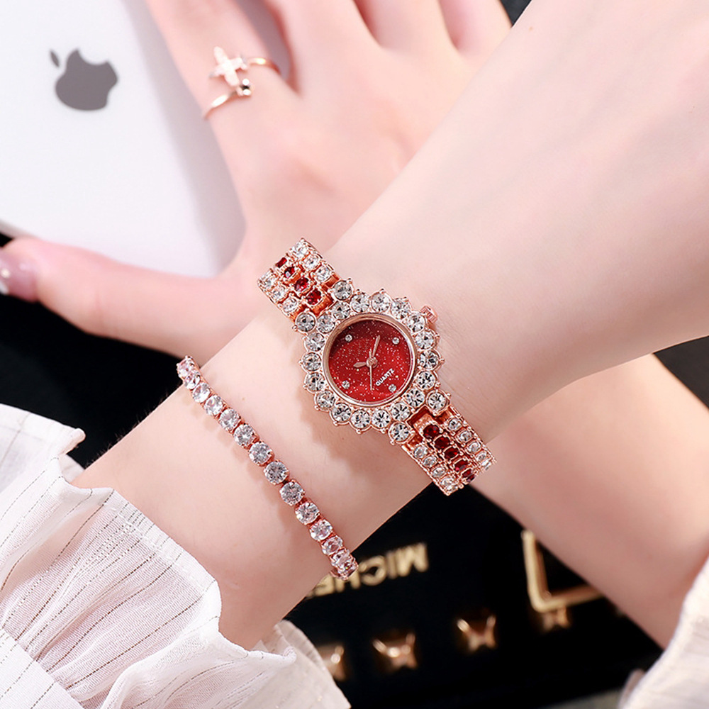 Rose gold with red diamonds and red face
