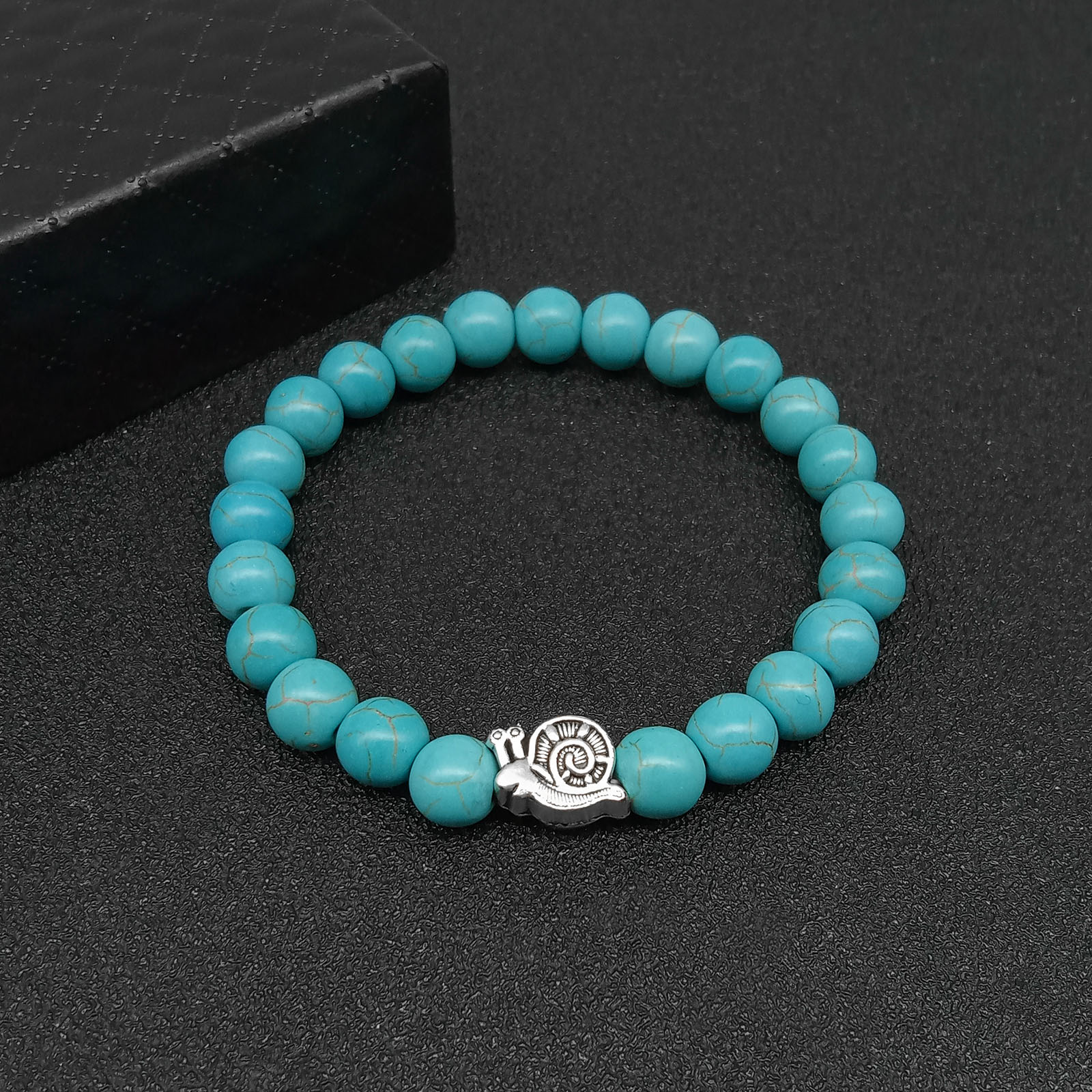 1:Snail turquoise Hand String