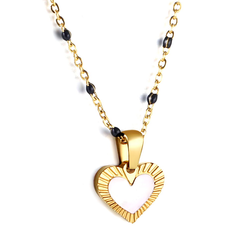 Heart-shaped white drop oil pendant with black beads
