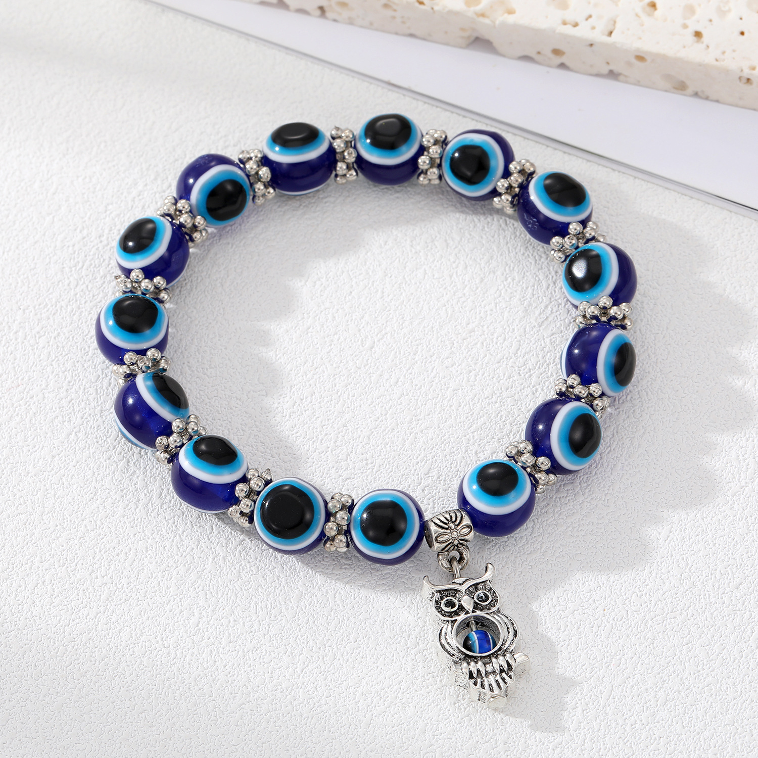 Large blue beaded owl bracelet