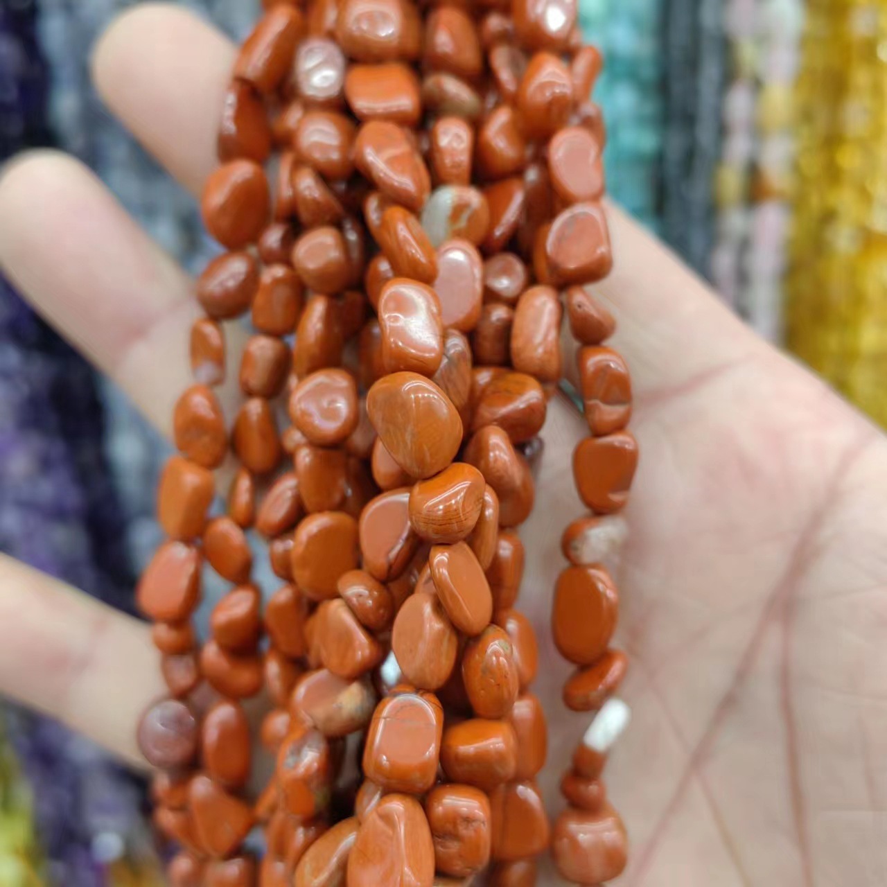 The natural red stone is about 6 × 8 mm