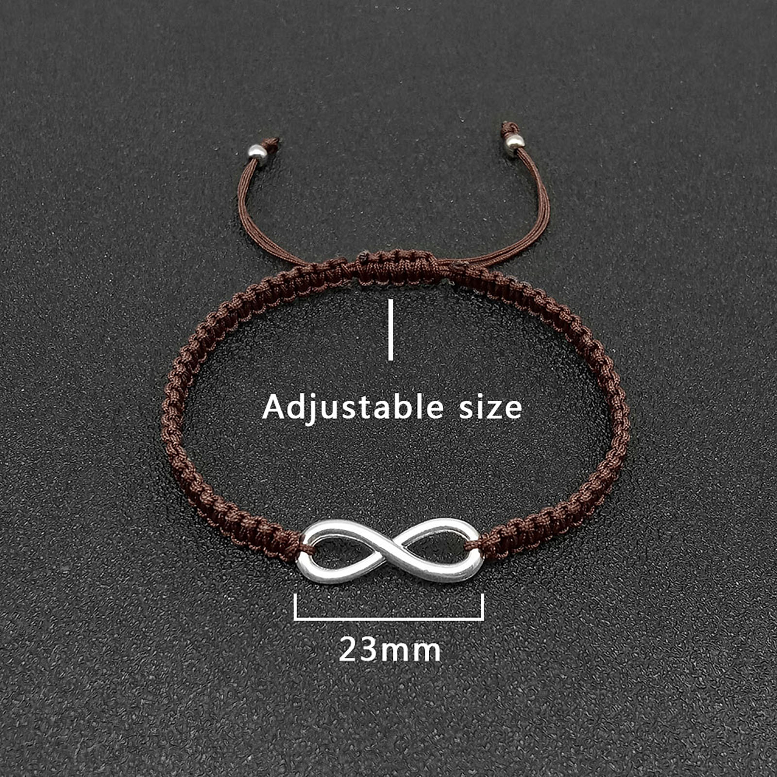 1:The symbol length is 23mm, and the size of the hand rope is adjustable