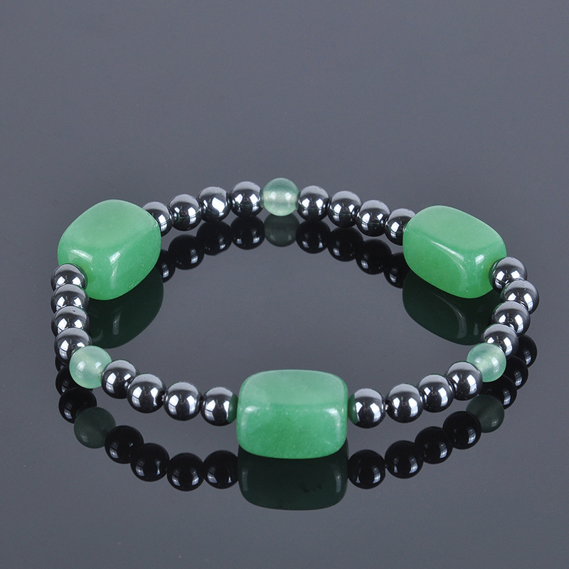 Green rectangular block with bead bracelet