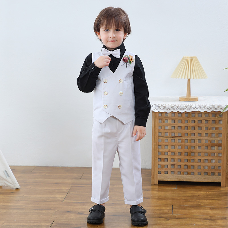 White vest , pants , black shirt with bow tie corsage