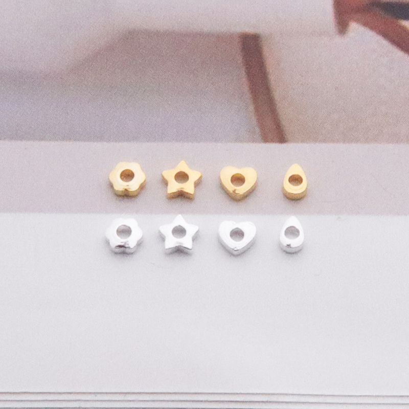 Plain silver, heart-shaped beads