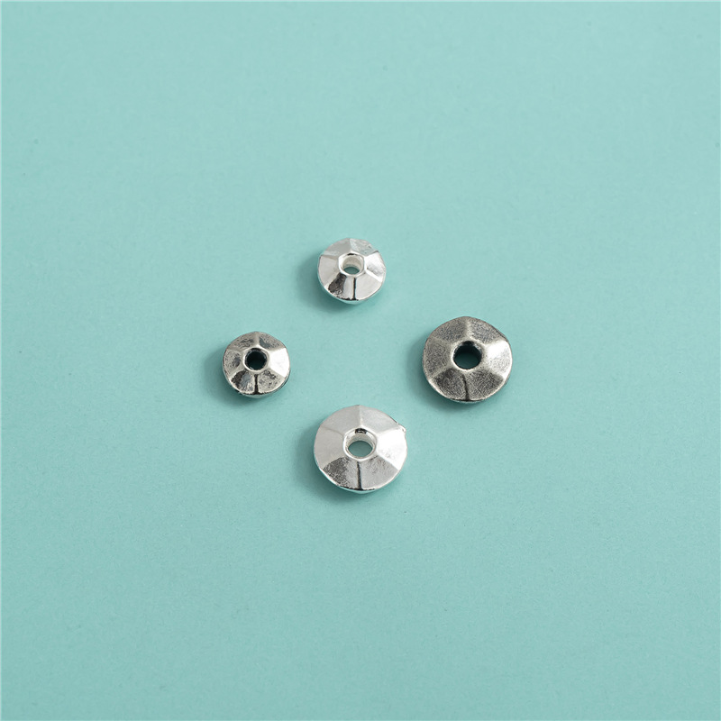 Small, plain silver width about: 5.8 mm hole about