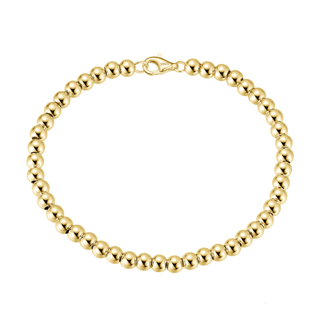 The 14K gold bracelet is 18cm long